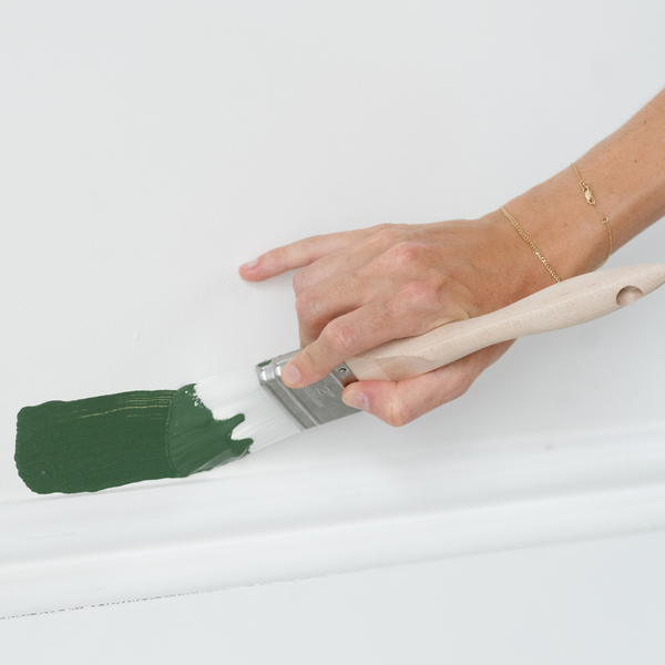 2" cut in cutting into wall with green paint