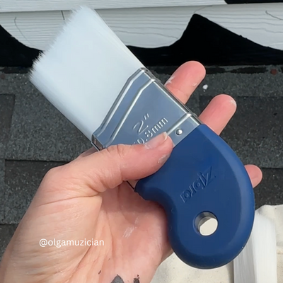 ergonomic blue handle paintbrush that fits in the palm of your hand paint brush