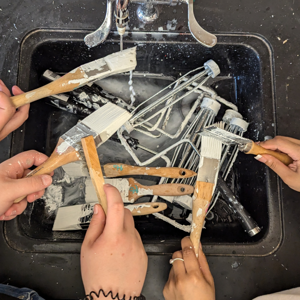 paint brushes in sink