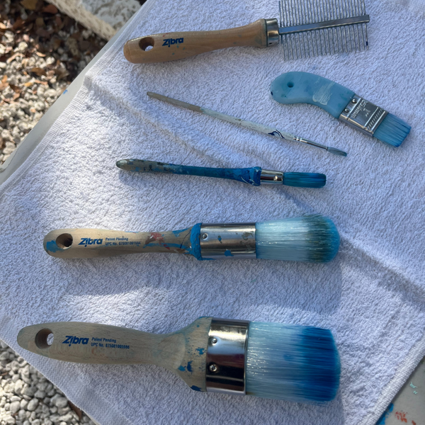 paint brushes flat to dry